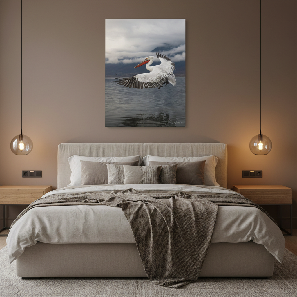 Dalmatian Pelican in Flight Over Still Waters – By Photographer Lukas Andersen